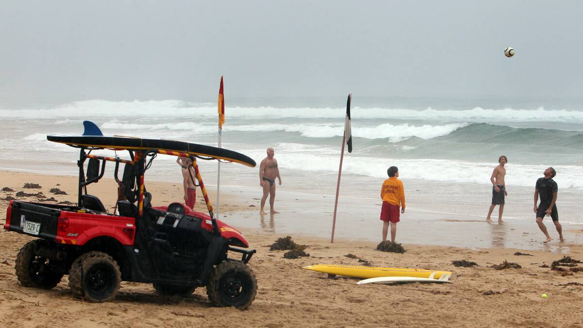 Sandon Point beach might have been open but beach soccer was more appealing than a swim today. Picture: KEN ROBERTSON