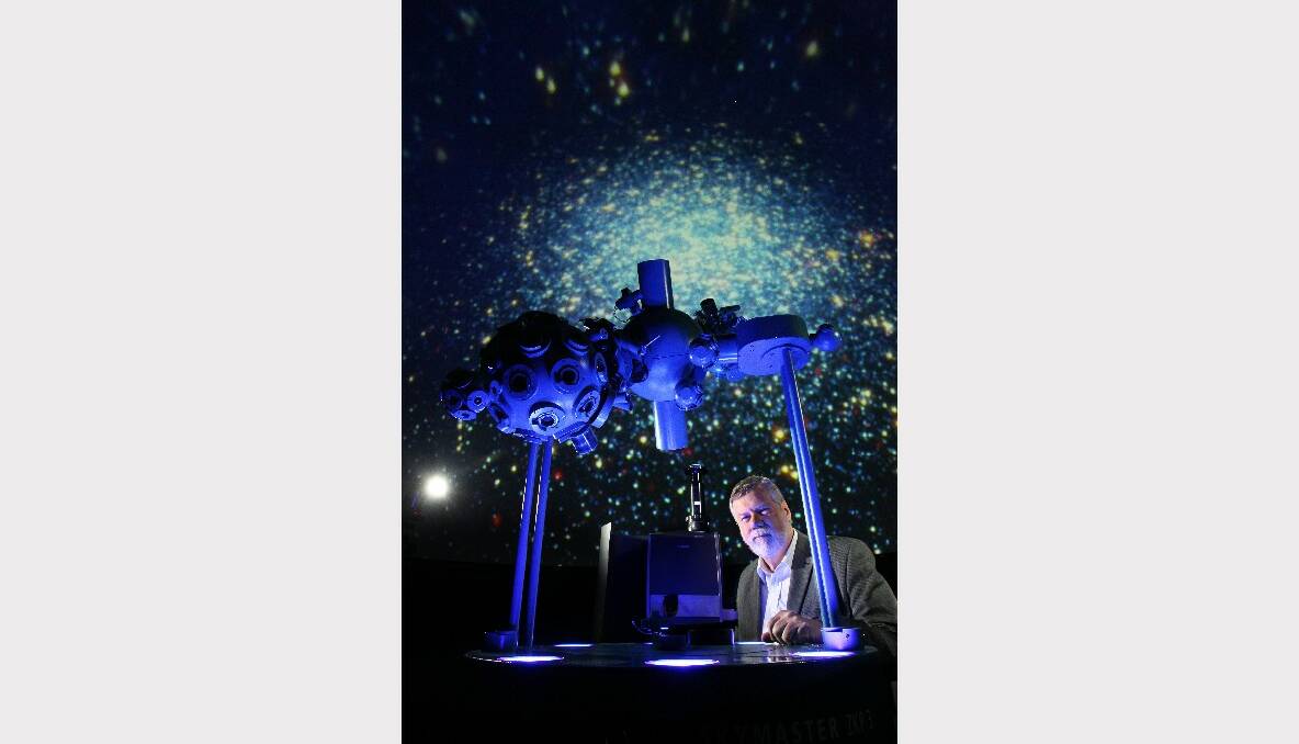 Wollongong Science Centre director Glen Moore in the planetarium. Picture: KEN ROBERTSON
