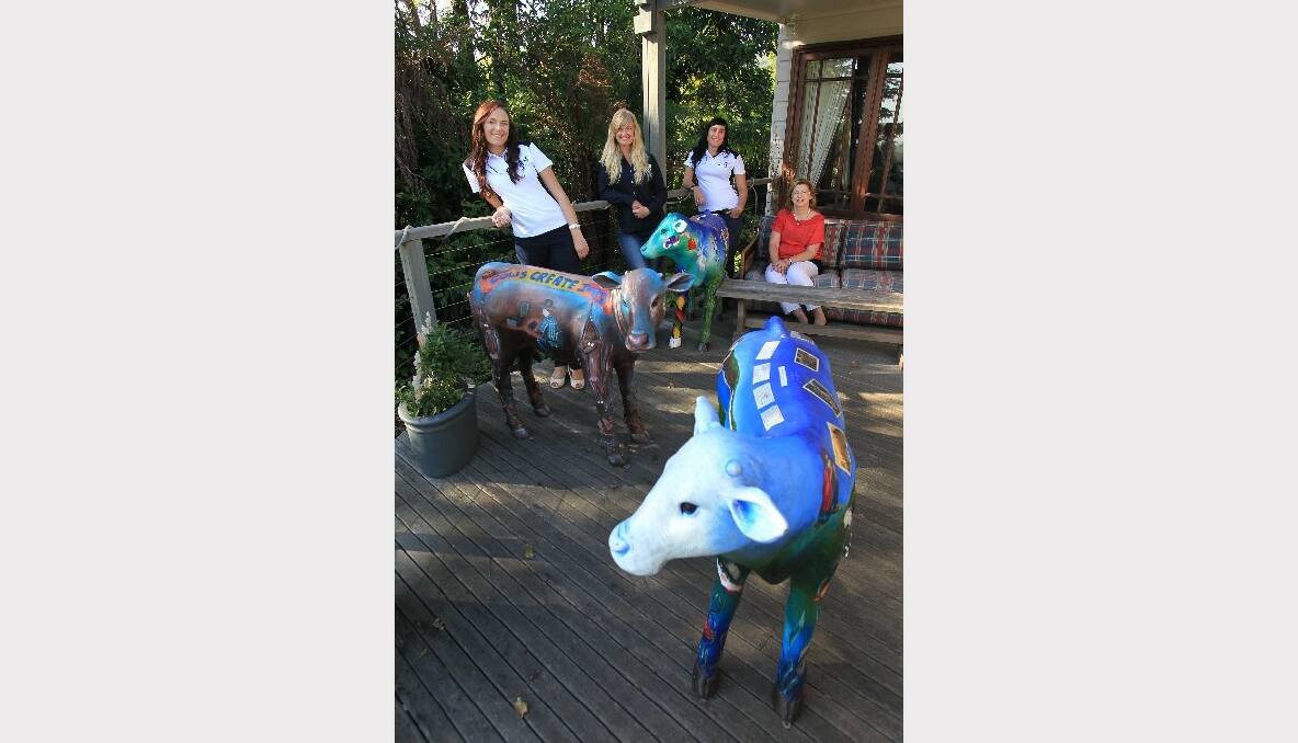 Jess Monteith, Megan Rowlatt, Renae Riviere and Lynne Strong at Jamberoo with some of the Archibull Prize cows. Picture: ORLANDO CHIODO