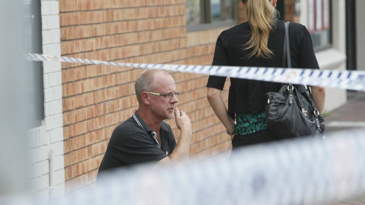 Fears: Owner Trevor Fredericks talks to detectives after the second armed raid.Picture: DAVE TEASE