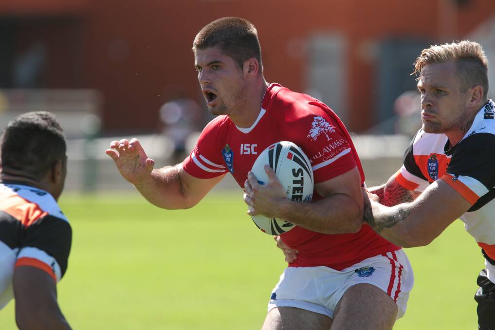 The Cutters' Charly Runciman takes on the Tigers defence. Picture: ADAM McLEAN