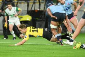 Brett Cameron was among the scorers as the Hurricanes crushed the hapless Waratahs. (Elias Rodriguez/AAP PHOTOS)